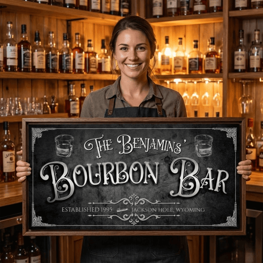 A woman holding a personalized Bourbon Bar Sign in a rustic bar with whiskey bottles.