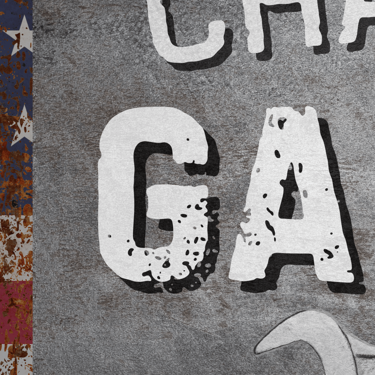 Close-up of a personalized Metal Garage Sign with weathered design and American flag elements.