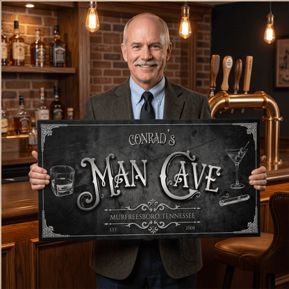Vintage Man Cave Sign held by a man in a suit, featuring custom text and elegant design for a gentleman's retreat.