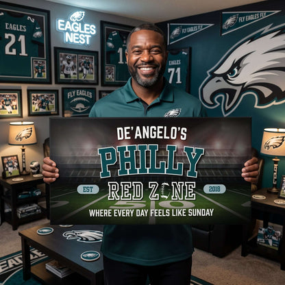 Man holding a personalized Philadelphia Football Sign in a decor featuring Eagles memorabilia.