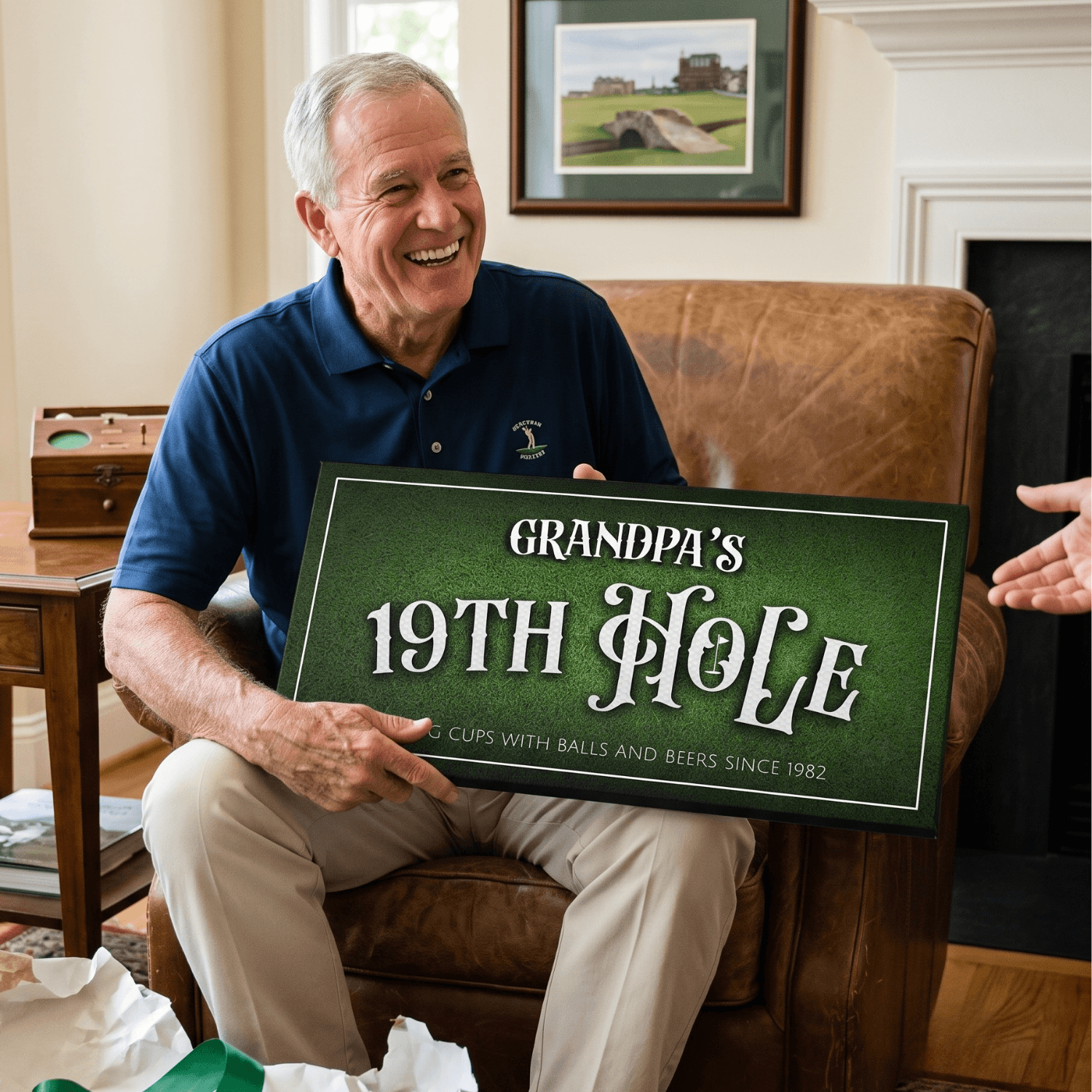 Grandpa holding a personalized 19th Hole Sign in a cozy living room, celebrating golf traditions.