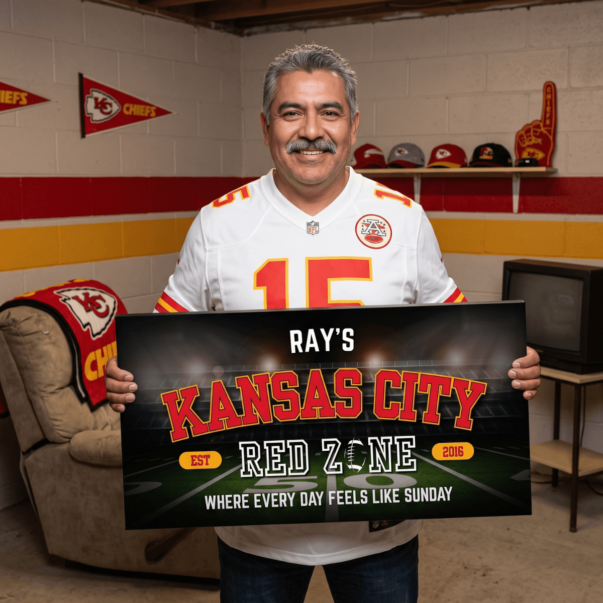 Man holding a personalized Kansas City Football Sign in a fan cave, showcasing team spirit and loyalty.