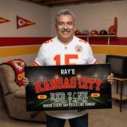 Man holding a personalized Kansas City Football Sign in a fan cave, showcasing team spirit and loyalty.