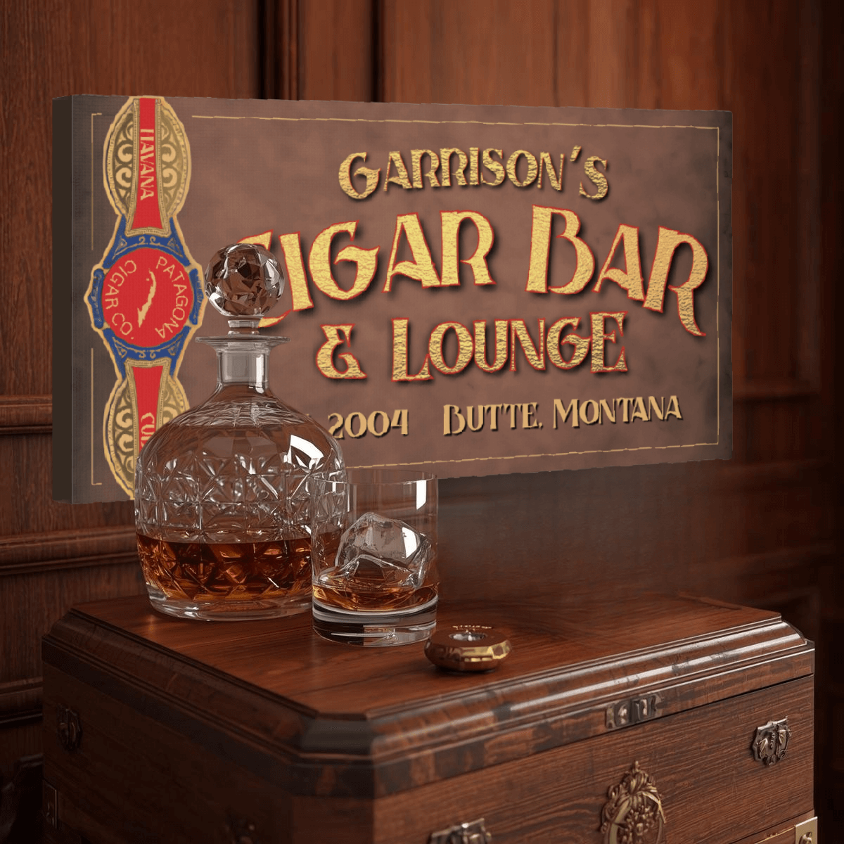 Decorative man cave sign for 'Garrison's Cigar Bar & Lounge' with a decanter and glass on a wooden chest.